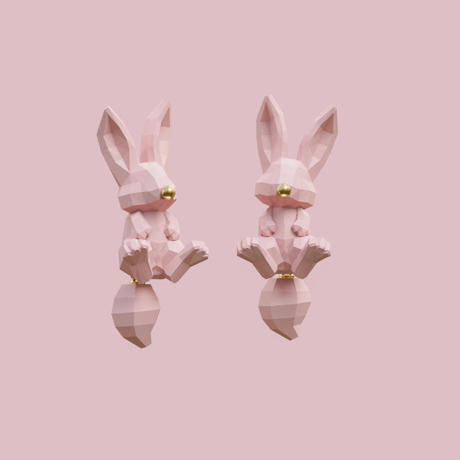 Geometric bunny stud earrings in blush pink and white with gold nose detail on a soft pink background
