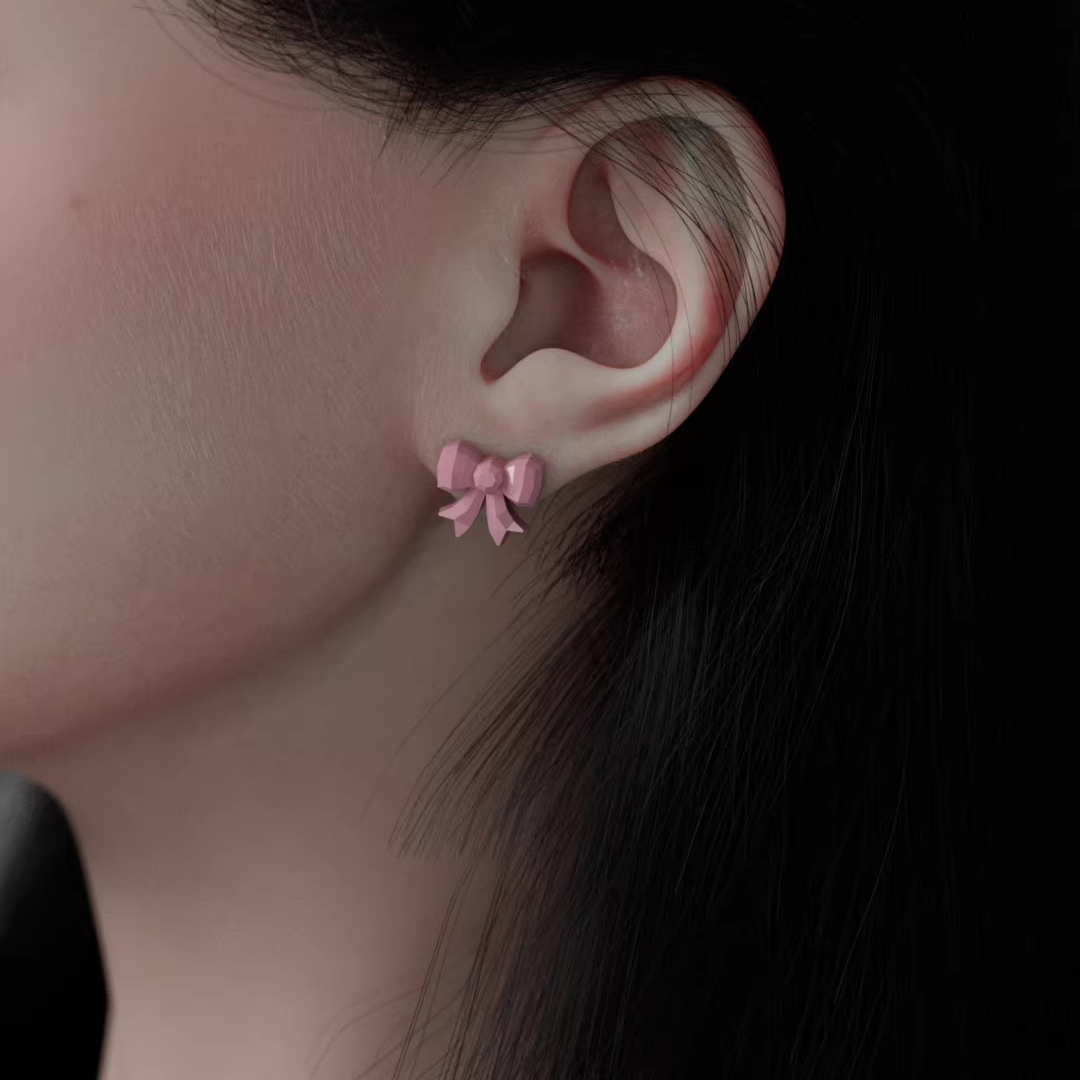 Pastel pink gift box earrings with a white bow and a small bunny figure popping out, cute handmade acrylic jewelry shown from multiple angles