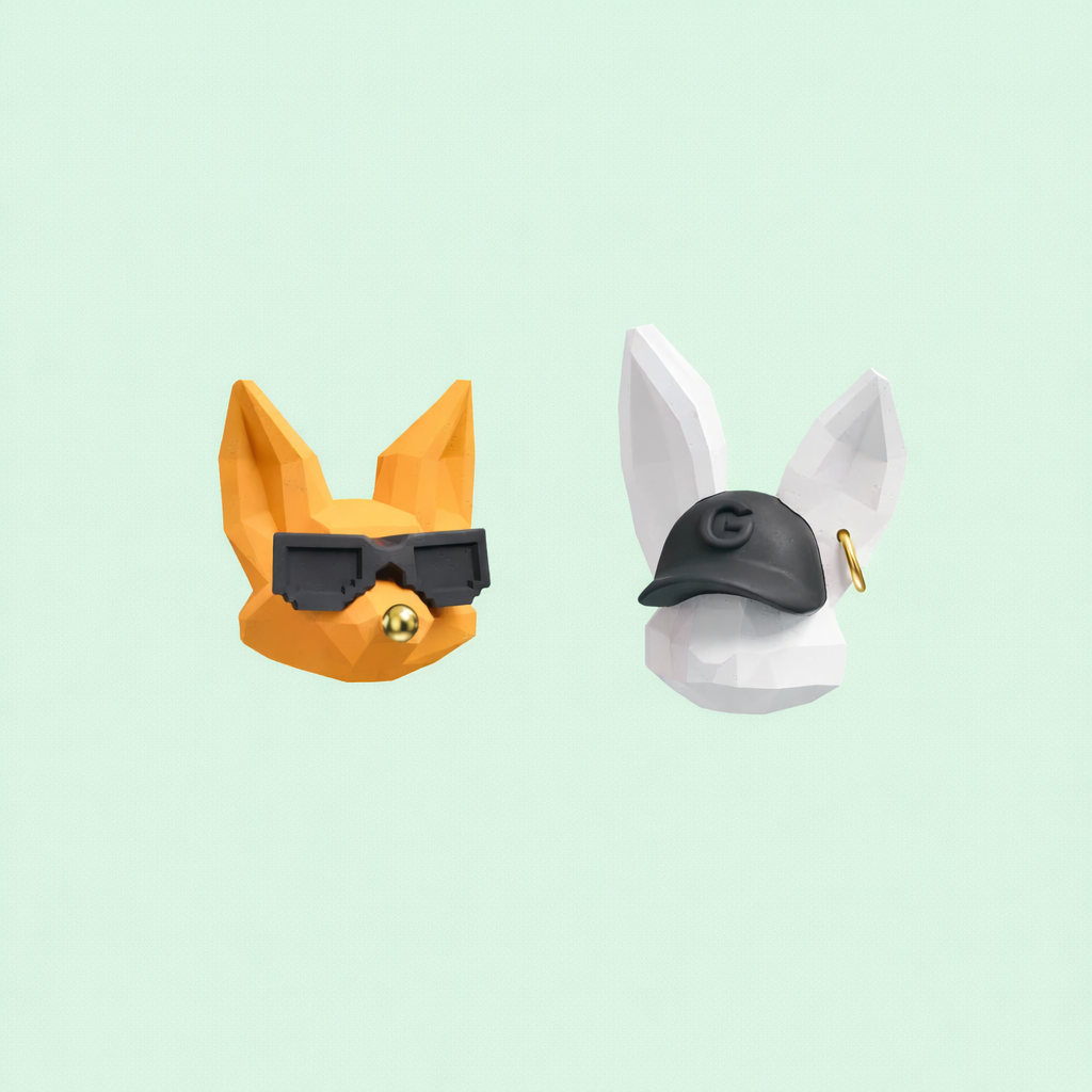Handmade fox and bunny character earrings with sunglasses and cap, cute statement jewelry on a mint background.