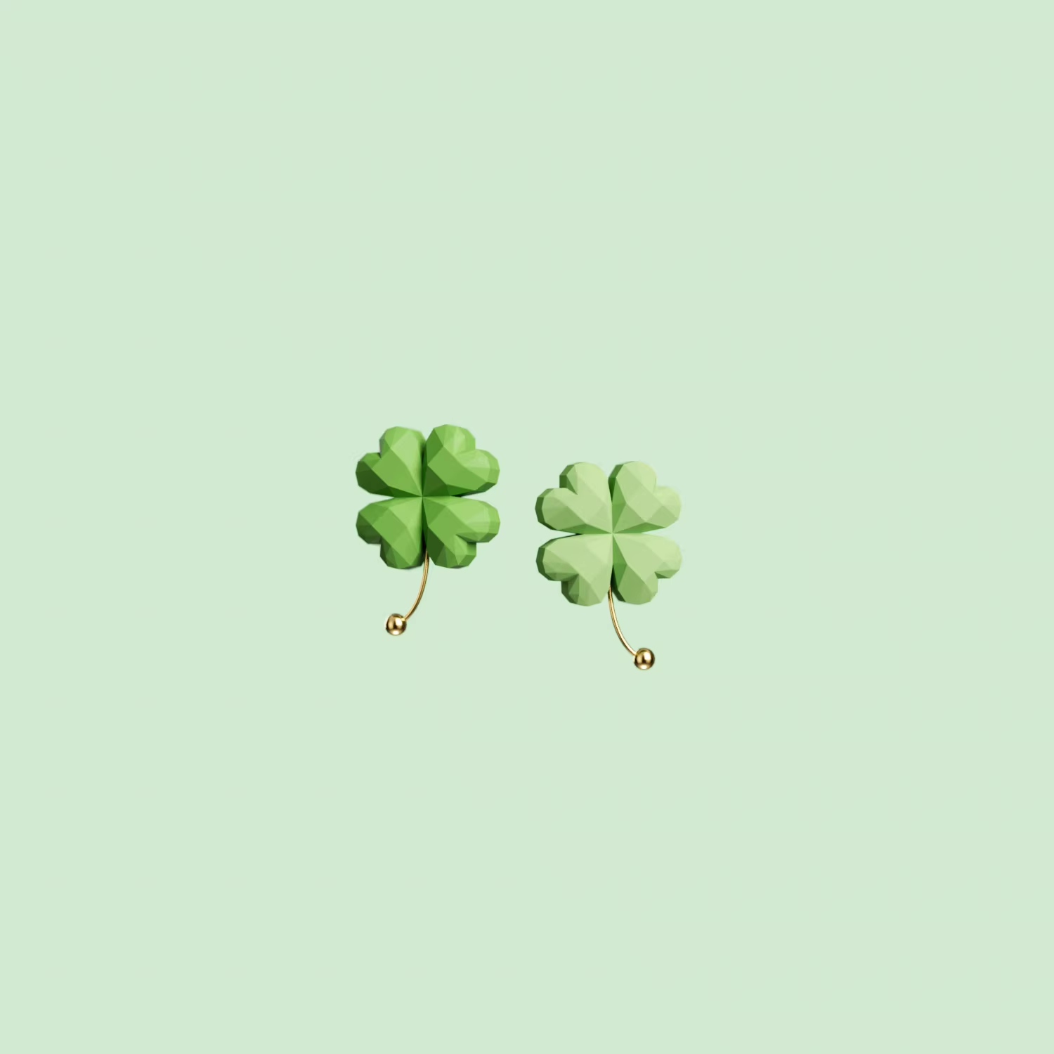 Green four-leaf clover drop earrings with gold accent, lightweight pastel jewelry on soft green background