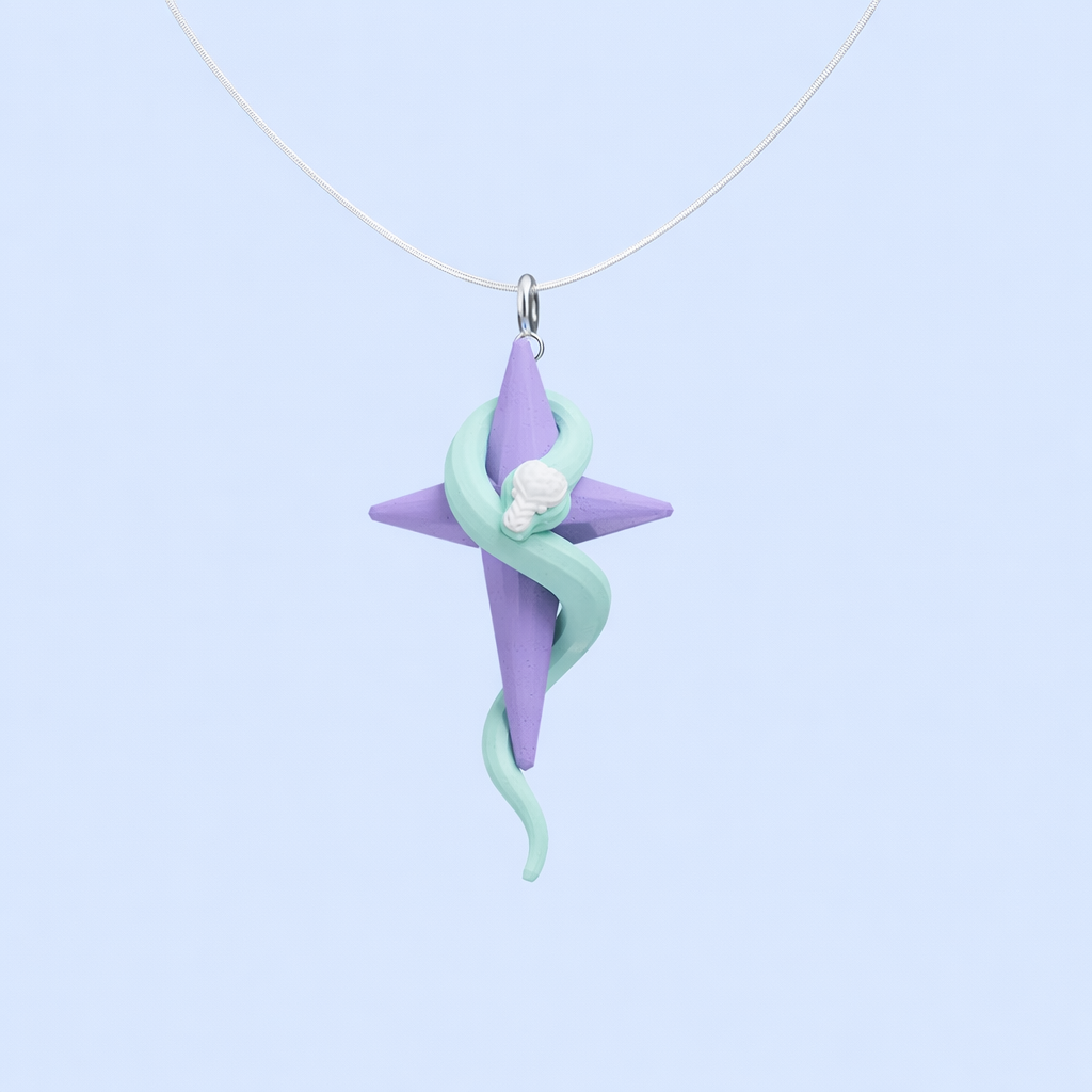 Handmade pastel star and snake pendant necklace with soft purple and mint colors on a silver chain.